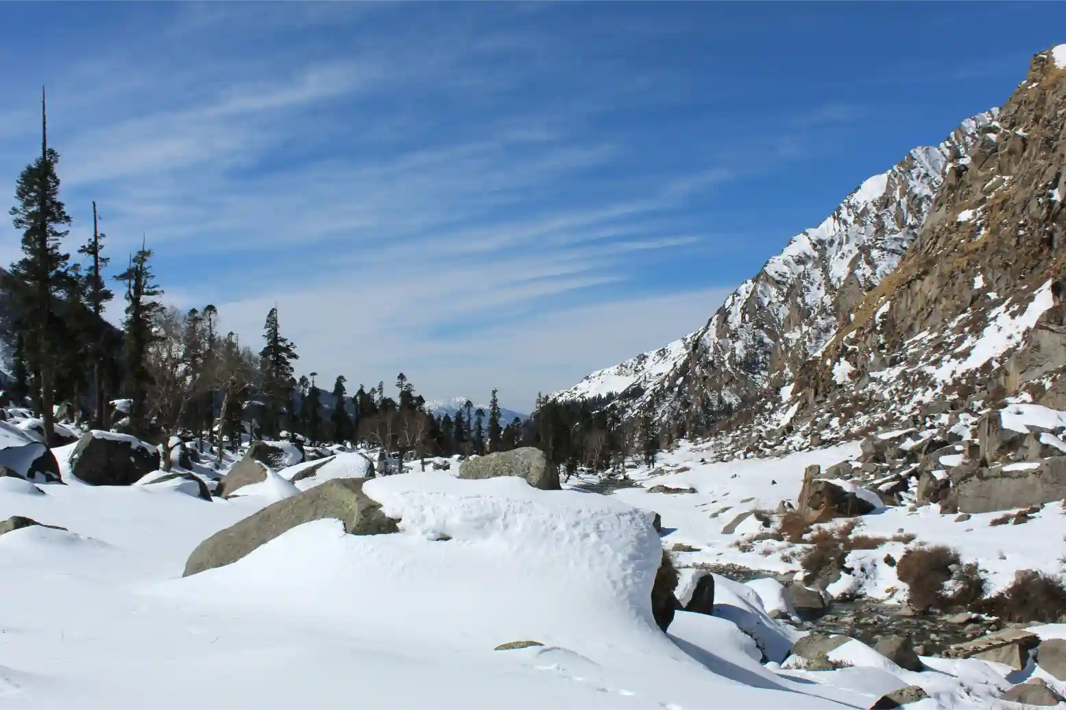 Snowy riverside valley Har Ki Dun