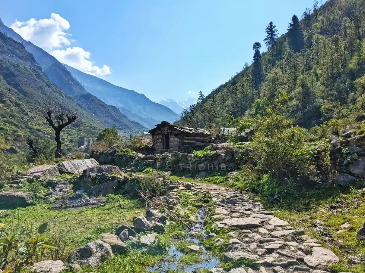 Stone path and cabin on Har Ki Dun trail