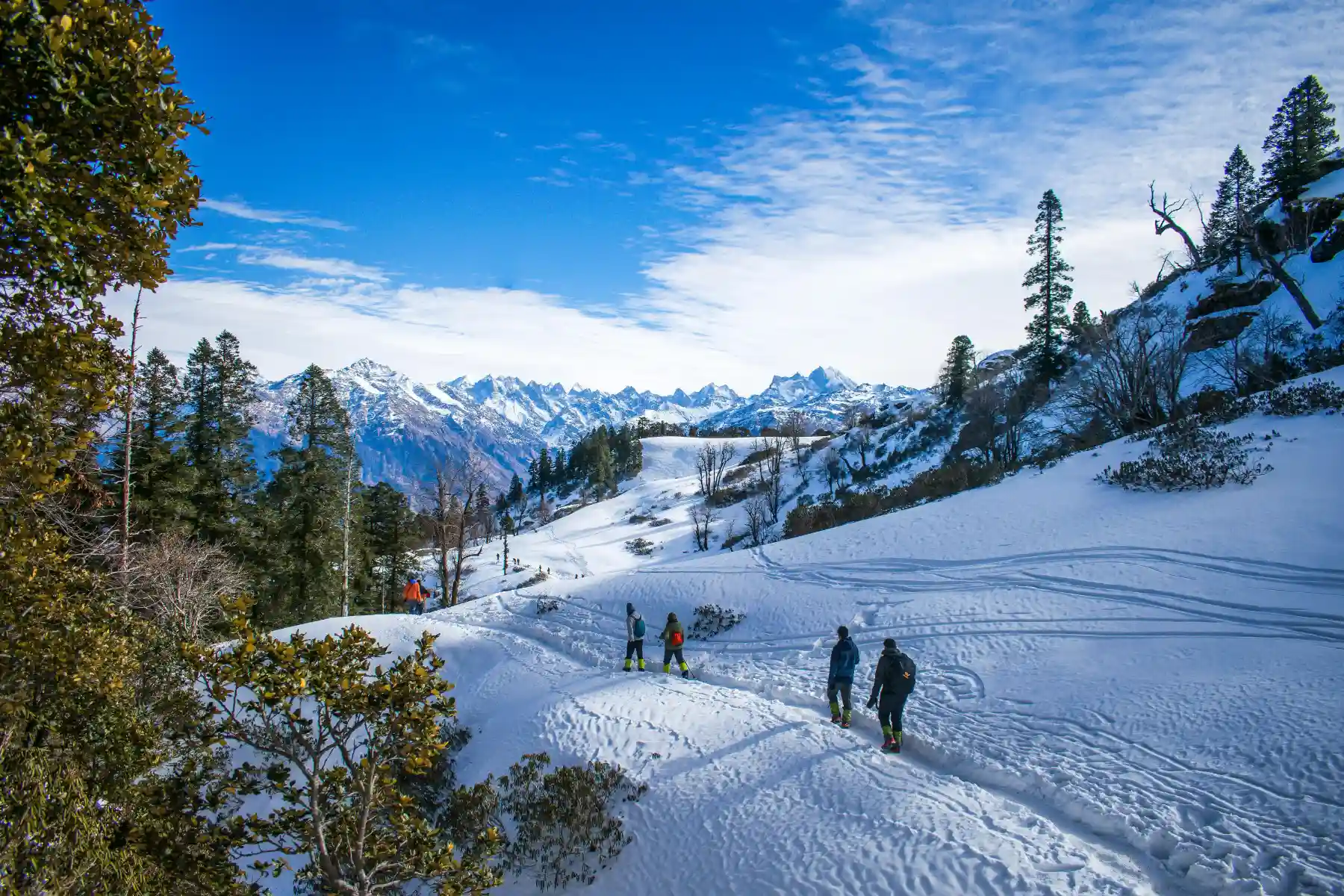 Trekkers on snow trail Kedarkantha